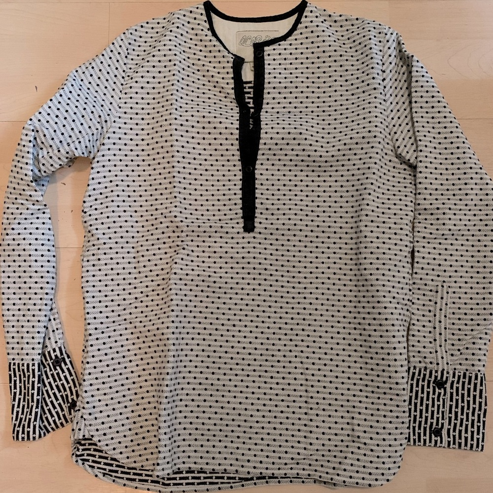Loose fitting, 100% cotton tunic shirt.